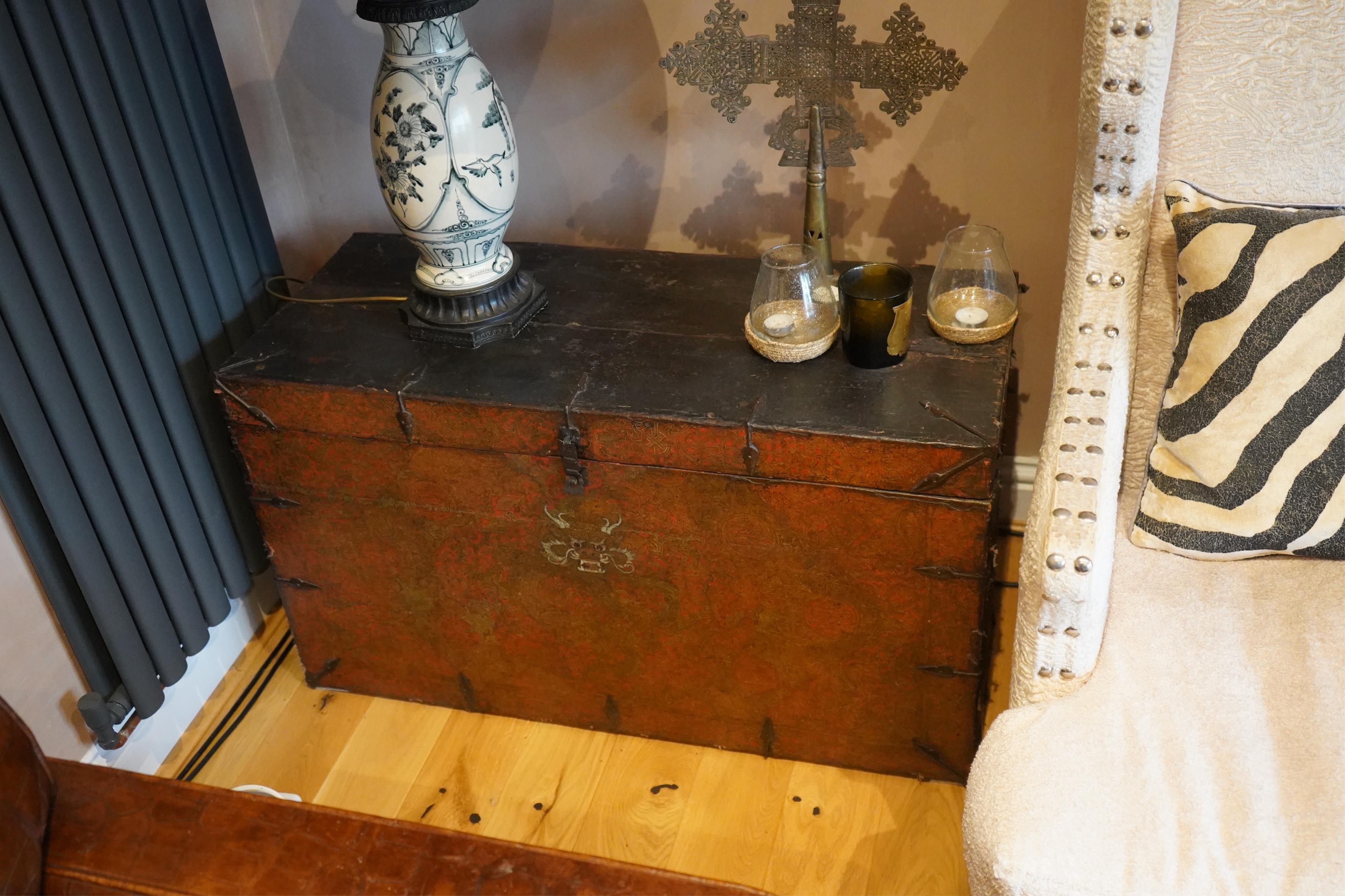 A pair of early 19th century Tibetan trunks, width 100cm, depth 42cm, height 57cm. Condition - poor